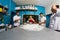 Group of happy young asian pastry chef preparing dough with flour, profesional chef working at kitchen