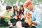 Group of happy young asians having a picnic at the park