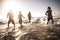 Group of happy young millennial people play and run in the sea waves water together - friends having fun in playful summer holiday