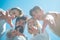 Group of happy young people in circle outdoors. Bearded male. Blue sky. Friendship day. Stylish people. Circle of