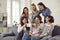 Group of happy young women drinking coffee, laughing and enjoying fun time together