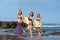 group of happy young women with surfboard