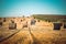 Group of haystack rolls left in a field after harvesting grain crops