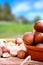 Group of hazelnuts on a wooden table in field vertical composit