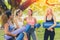 Group of healthy girl with yoga mat enjoy talking together relax scene after finish yoga outdoor class