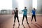 Group of healthy sporty determined friends fitness training toge