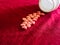 Group of hearts pills in red cloth background. Valentines day