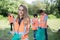 Group Of Helpful Teenagers Collecting Litter In Countryside