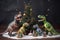 A group of Herrerasaurus decorating a Christmas tree. AI generation