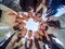 A group of high school graduates in a circle look down. The concept of friendly students.