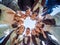 A group of high school graduates in a circle look down. The concept of friendly students.