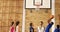 Group of high school kids playing basketball