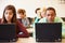 Group Of High School Students In Class Using Laptops