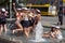 Group of high school students at a fountain celebrating finishing high school in Arhus, Denmark on 25 June 2020