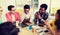 Group of high school students sitting at table