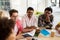 Group of high school students sitting at table