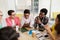 Group of high school students sitting at table