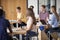 Group Of High School Students Sitting At Work Benches Having Discussion In Design And Technology Lesson