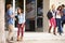 Group Of High School Students Standing Outside Building