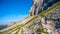 Group of hikers ascending the mountain in Dolomites