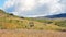 Group of hikers going through sun lit valley during descent from pic Boby in Andringitra national park. View from behind, no