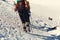 Group of hikers in the mountain. climbers with backpacks and crampons on trail