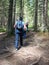 group of hikers on mountain trail in the Carpathian forest