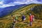 Group of hikers in the mountains, view of Carpathians mountains