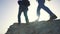 group of hikers silhouette a with backpack walking mountains. adventure travel teamwork concept. lifestyle tourists