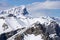 Group of hikers on top of snowy mountain peak in Canadian Rockies