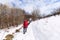 Group of hikers walking on the hike trail on snow