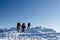 Group hikers in winter mountains