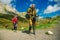 Group hiking in the Mountains of Republic of Adygea with large backpacks. Russia