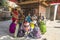 A group of Hindu women devotees in colorful sarees chanting prayers inside the Kathmandu Durbar Square