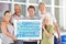 Group holding fitness tag cloud in gym