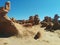 Group of hoodoo rock formations on hills in Goblin Valley