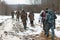 Group of hunters walking on the field