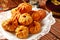 Group of individual pies with meat and potato - vak balish. Tatar traditional pies. Wooden background. Top view