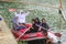 a group of Indonesian people is on inflatable boat without wearing a life jacket at Batukarut Lake or Situ Batukarut Sukabumi,