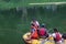 a group of Indonesian search and rescue army (Tim SAR) with life vests on an inflatable boat is searching for a body