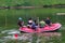 a group of Indonesian search and rescue army (Tim SAR) with life vests on an inflatable boat is searching for a body