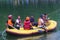 a group of Indonesian search and rescue army (Tim SAR) with life vests on an inflatable boat is searching for a body