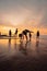 a group of Indonesian women doing gymnastic exercises very agile on the beach