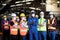 Group of industrial foreman and worker team consist of Technicians, Engineers and factory Manager wearing helmet and surgical mask