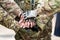 Group of Infantry soldiers holding hands together expressing positive for military combat teamwork