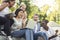 Group of international students celebrating success, checking exam results online