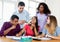 Group of international students with teacher preparing for exam