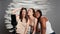 Group of interracial women having fun with photos