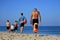 Group of Israeli men  going for a swimming exercise in the Mediterranean sea