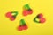 Group of jelly candies cherries on yellow background